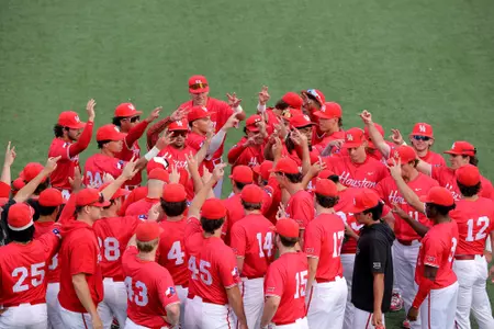 Team huddle with hands raised