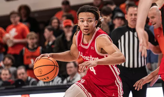 Kingston Flemings dribbles a basketball