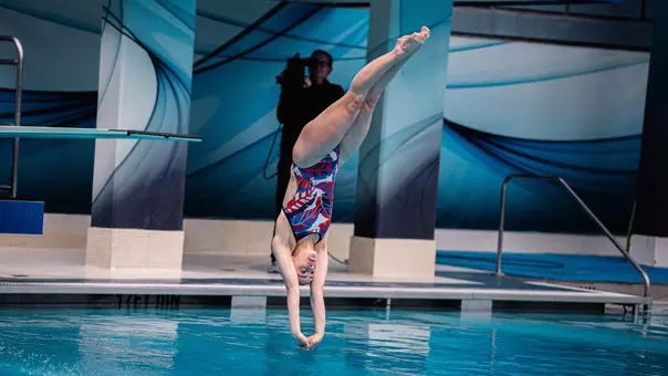 Junior Michelle McLeod diving off the 3-meter at the Big 12 Conference Championship