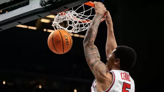 Chris Cenac dunks a basketball
