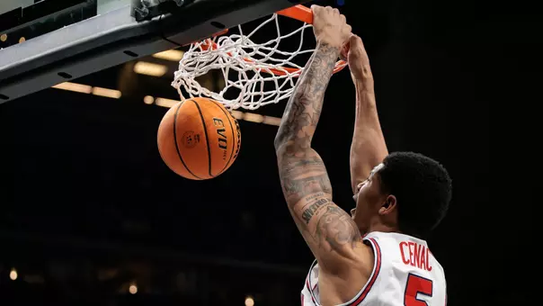 Chris Cenac dunks a basketball