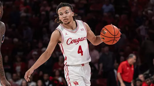 Kingston Flemings dribbles a basketball