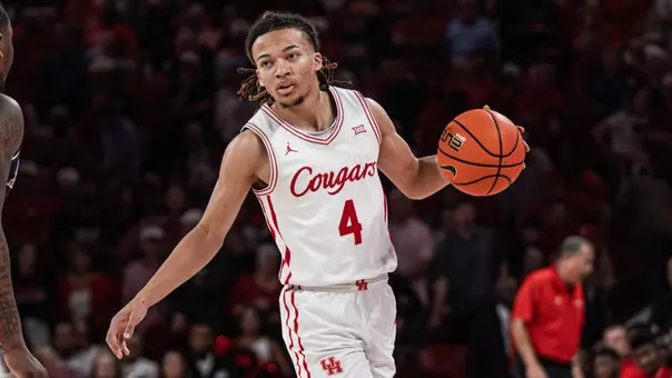 Kingston Flemings dribbles a basketball
