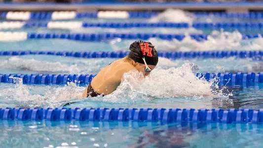 Senior Virag Peter swimming the breaststroke at the Big 12 Conference Championships