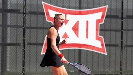 Sophie Schouten fist pumps after winning a point