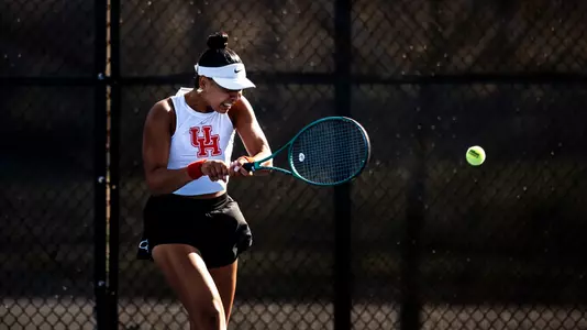 Chems Doha Zeghlouli hits a tennis ball