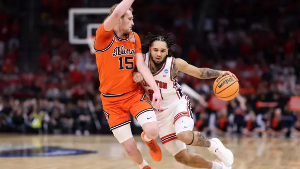 emanuel sharp drives with defender on his hip