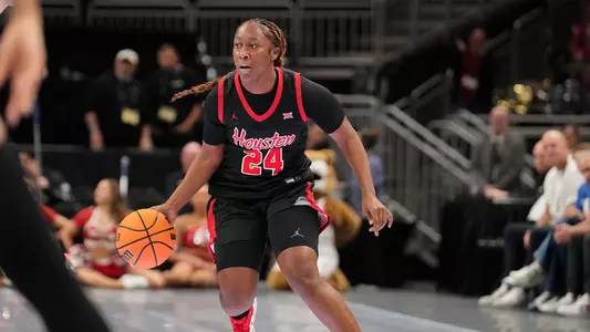 Shun'teria Anumele dribbling basketball against BYU in Big 12 Tournament