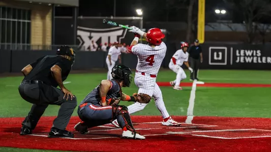 Riley Jackson swings a bat.