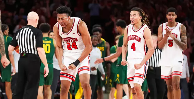 Chase McCarty yells in celebration against Baylor inside Fertitta Center