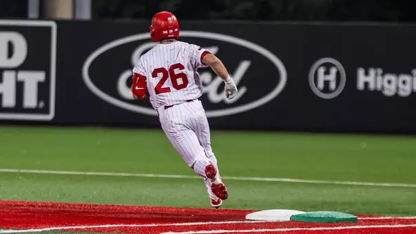 Dylan Maxcey rounds first base.