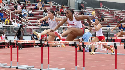 Kaycee McCoy leaping over hurdle