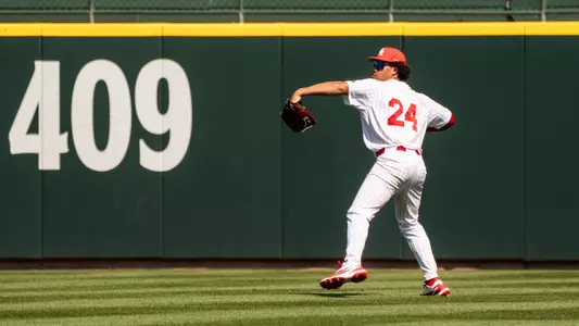 Blake Fields throws a ball in from the outfield