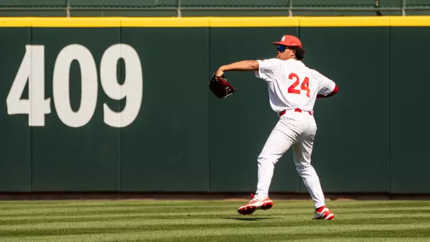 Blake Fields throws a ball in from the outfield