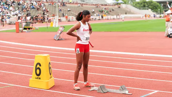Kamree Wolridge standing with baton in hands