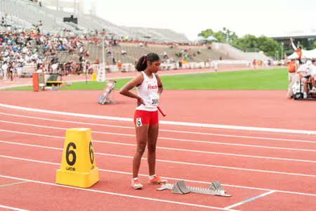 Kamree Wolridge standing and holding baton in hand
