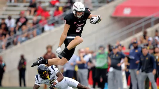 Tanner Koziol leaps over defender vs. West Virginia