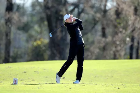 Natalie Saint Germain watches her tee shot