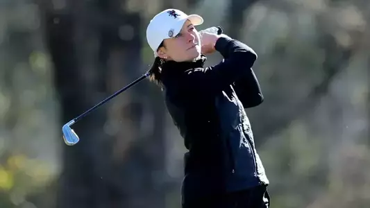 Natalie Saint Germain watches her tee shot