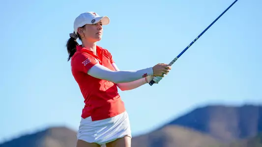 Natalie Saint Germain watches her tee shot