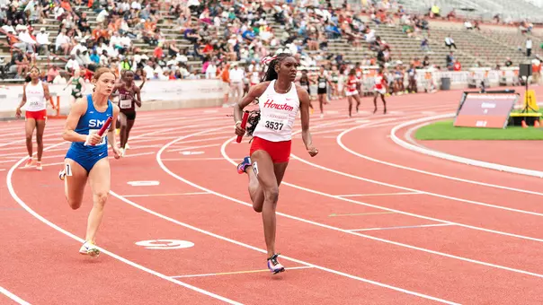 Carlysia Cresser running with baton