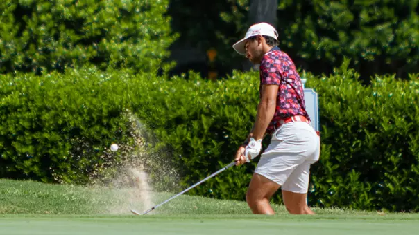 Hudson Weibel hits his shot from bunker during NCAA Bermuda Run Regional Second Round