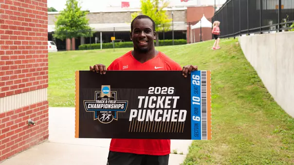 Cordell Nwokeji holding ticketing punched sign