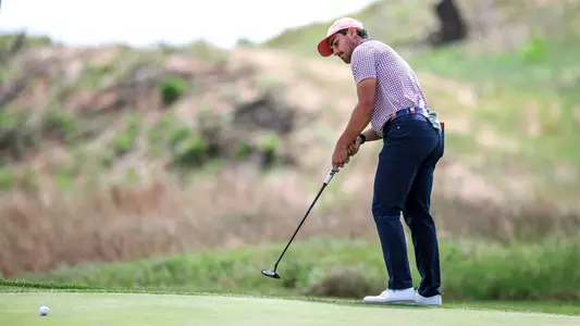 Hudson Weibel putts just off the green during Big 12 Championship First Day