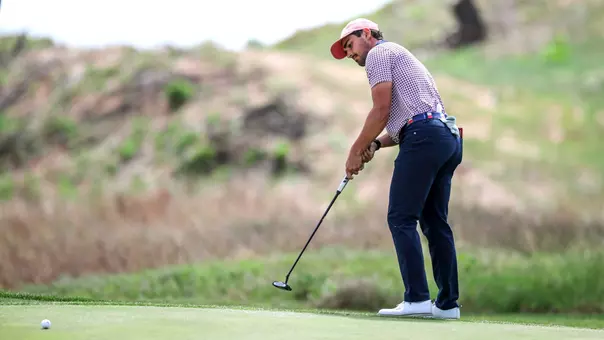 Hudson Weibel putts just off the green during Big 12 Championship First Day