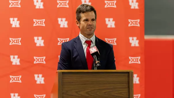 Will Davis at the podium for his introductory press conference