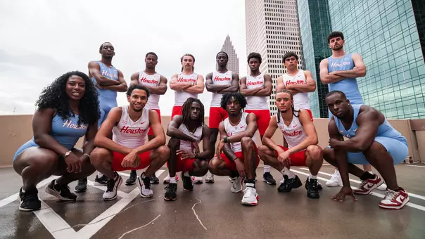 Houston Track & Field athletes posing in Houston blue uniforms and white and red uniforms