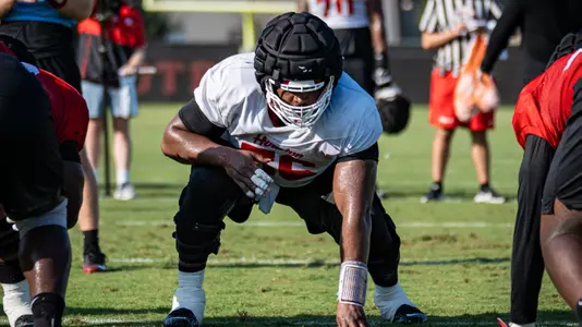 Shadre Hurst in set position on line during fall camp