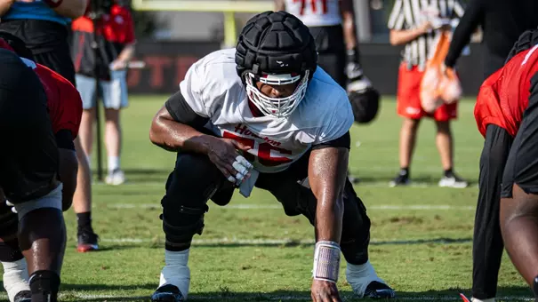 Shadre Hurst in set position on line during fall camp
