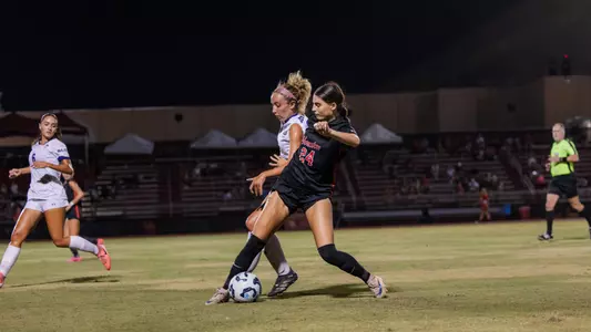 charlotte richardson fights for a soccer ball