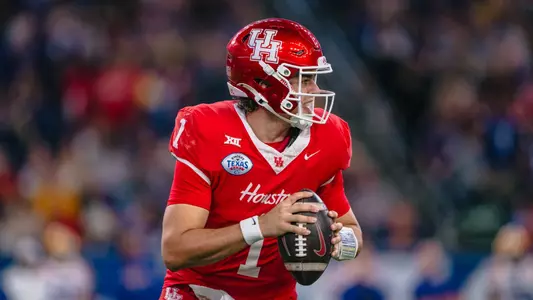 Conner Weigman runs with ball during Kinder's Texas Bowl