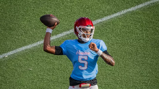 Keisean Henderson throws football at practice