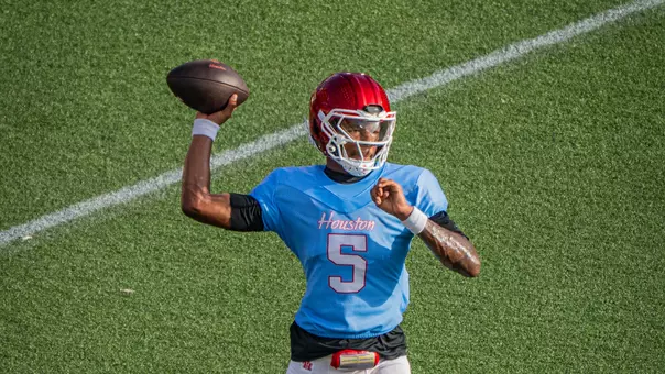 Keisean Henderson throws football at practice