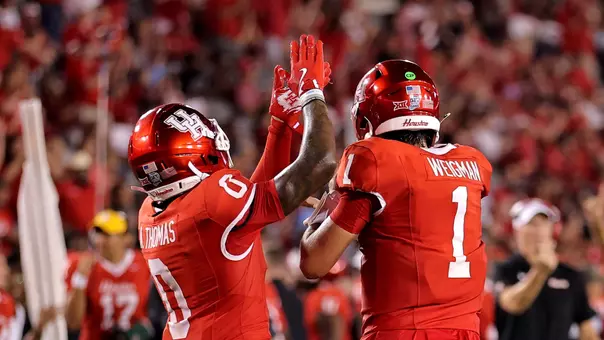 Amare Thomas and Conner Weigman celebrate vs. Colorado