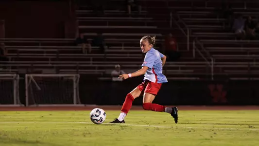 skylar miller dribbles the ball to goal