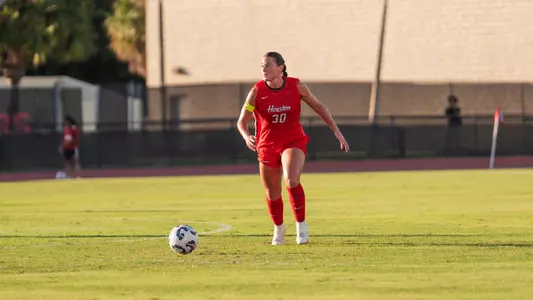Ella Morgan dribbles soccer ball
