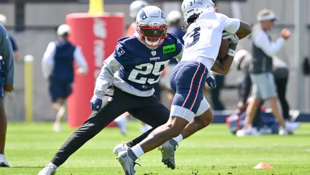 Jul 25, 2026; Foxborough, MA, USA; New England Patriots cornerback Marcus Jones (25) works with wide receiver DeMario Douglas (3) at training camp at Gillette Stadium. Mandatory Credit: Eric Canha-Imagn Images