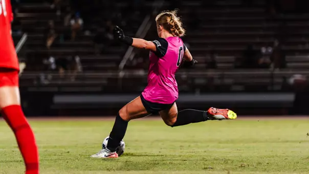 delilah burns kicks a soccer ball