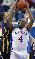 McCray Leads Surging Jayhawks Past Marquette, 74-55 Image