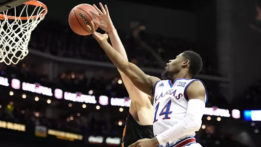 Newman, defense stifle Cowboys, in Big 12 Tourney opener Image