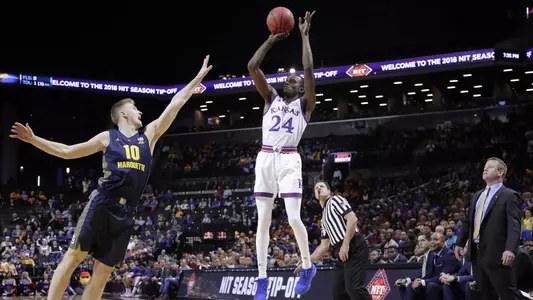Second half run pushes No. 2 Kansas past Marquette, 77-68 Image