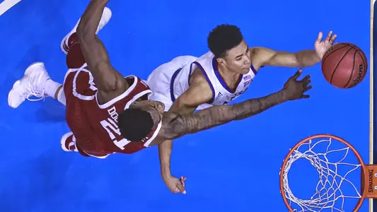 Jayhawks outlast Sooners, 70-63, to claim 28th-straight league opener Image