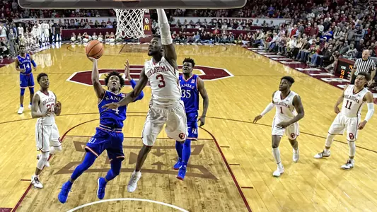 Sooners close strong, outduel Jayhawks, 85-80 Image
