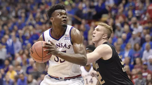 No. 3/2 Kansas outmuscles Oakland, 102-59 Image