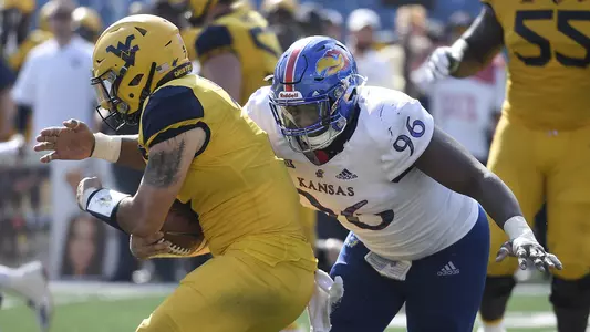 Jayhawks fall to No. 9/8 Mountaineers, 38-22 Image