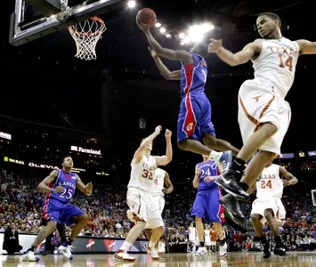Chalmers Scores 30 To Lift Kansas To 84-74 Victory Against Texas In Big 12 Championship Game Image